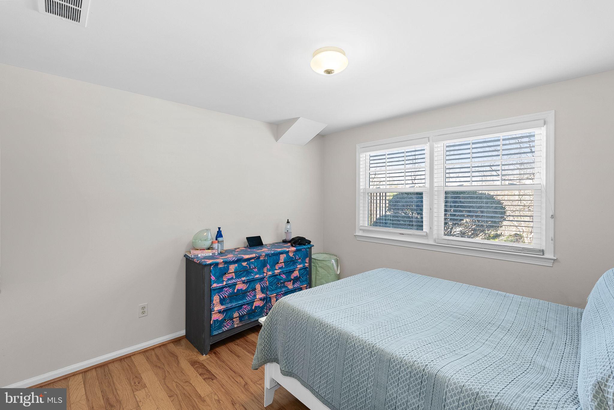 4119 27th Road North Arlington, VA 22207 - Photo 40 of 53 a bedroom with a bed and a window