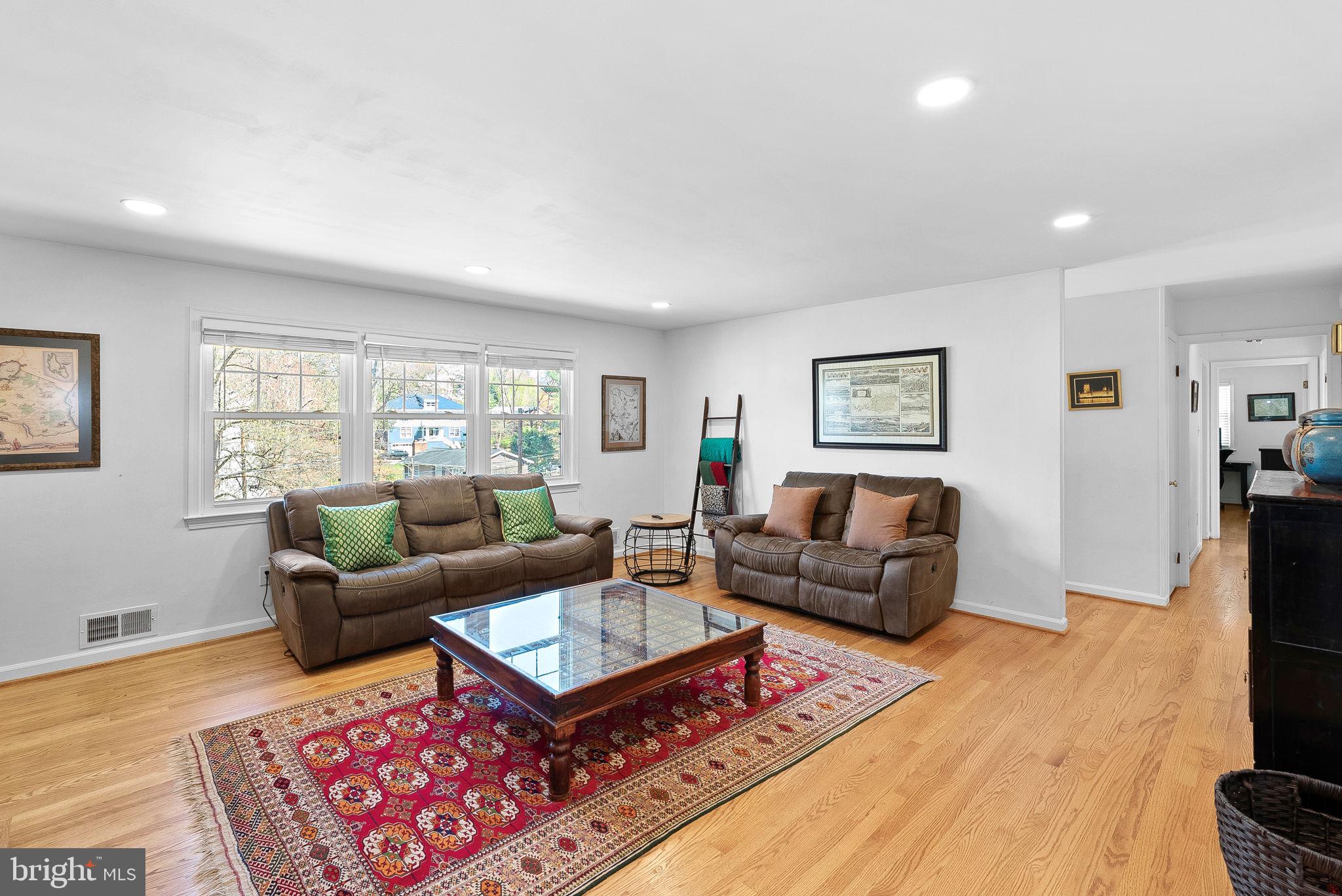 4119 27th Road North Arlington, VA 22207 - Photo 4 of 53 a living room with furniture a rug a window and a flat screen tv