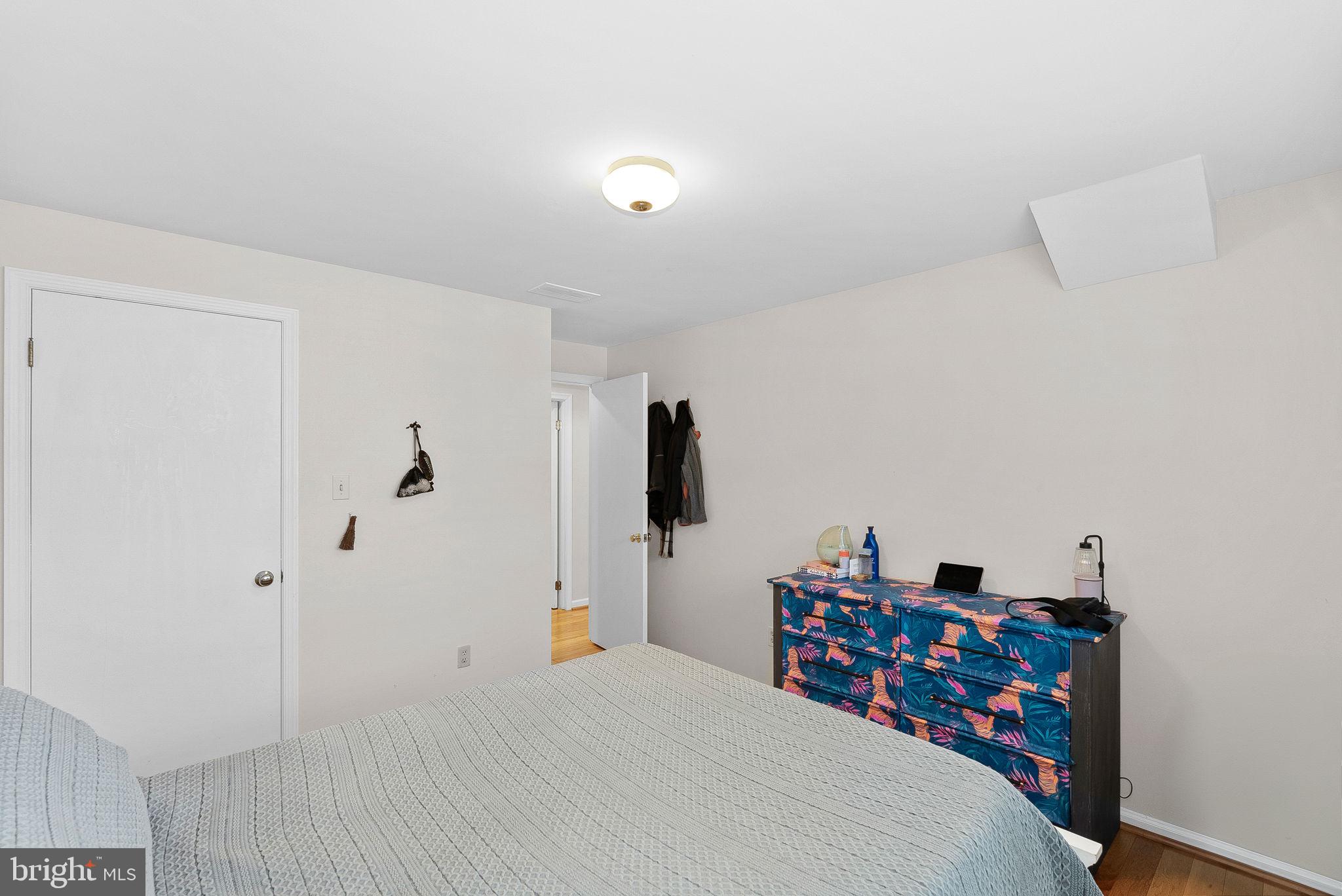 4119 27th Road North Arlington, VA 22207 - Photo 41 of 53 a bedroom with a bed and a refrigerator
