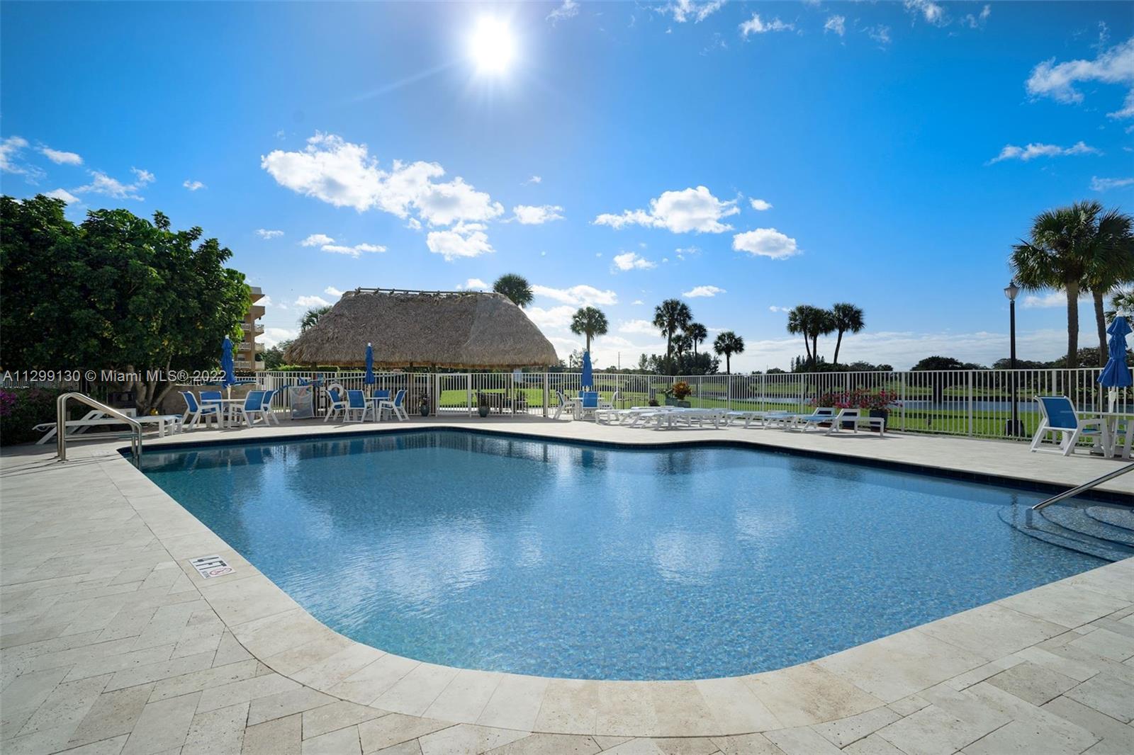 336 Golfview Road, Unit 502 North Palm Beach, FL 33408 - Photo 4 of 7 a view of a swimming pool and a terrace