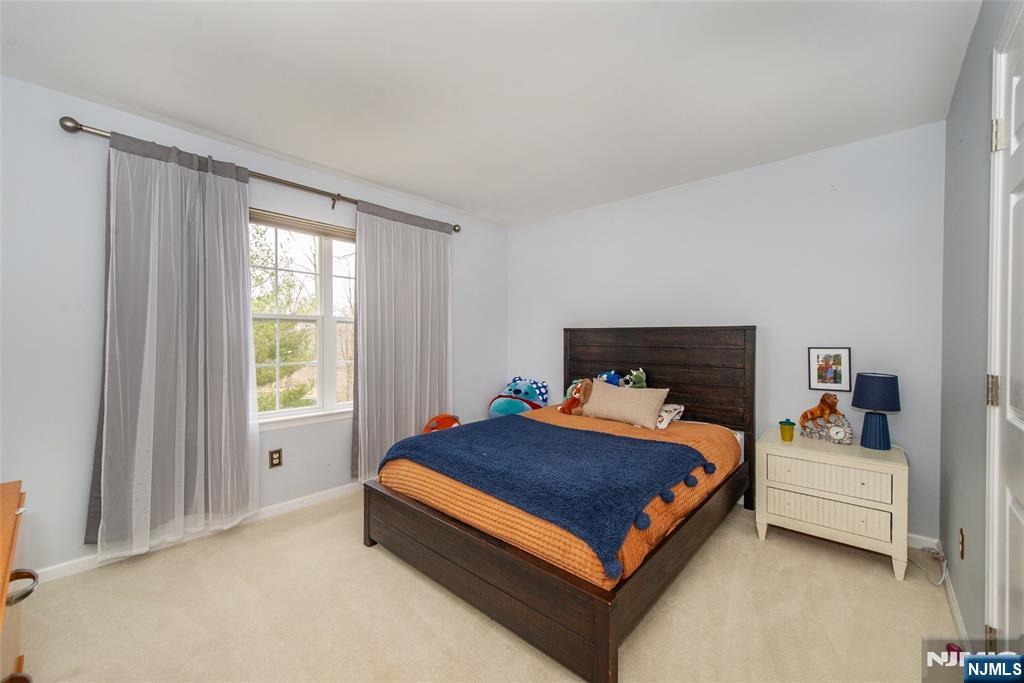 301 Cokesbury High Bridge Road Lebanon, NJ 08833 - Photo 16 of 31 a bedroom with a bed lamp and a window