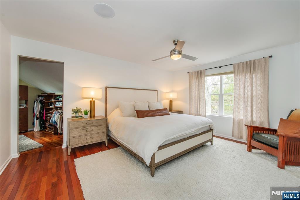301 Cokesbury High Bridge Road Lebanon, NJ 08833 - Photo 17 of 31 a bedroom with a bed and a chandelier