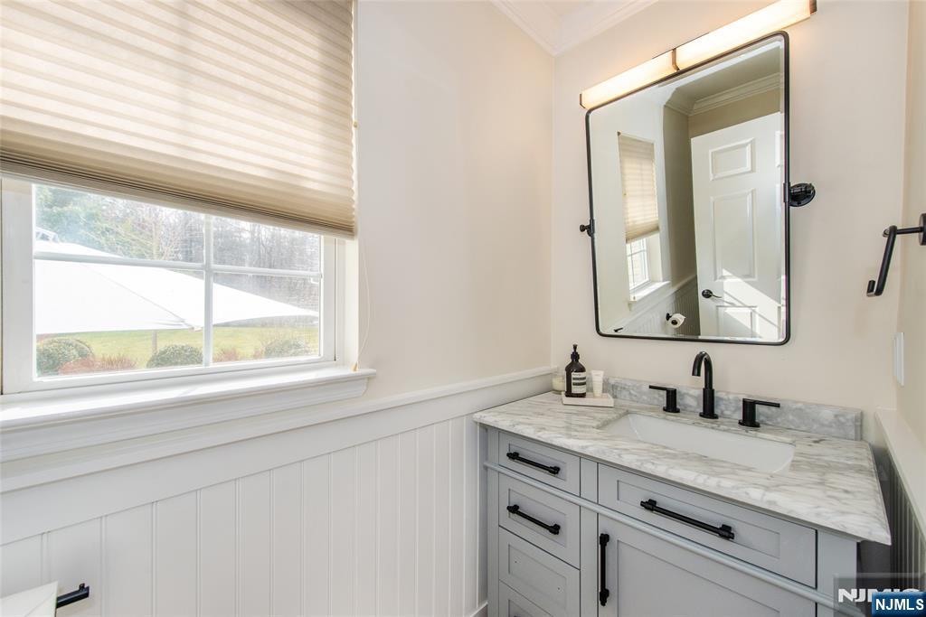 301 Cokesbury High Bridge Road Lebanon, NJ 08833 - Photo 18 of 31 a bathroom with a granite countertop sink a mirror and a window