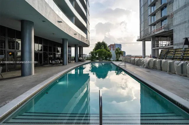 a view of a swimming pool with patio