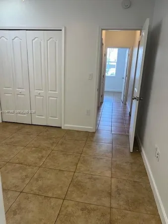 a view of a bathroom with wooden floor