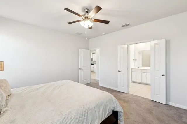 a bedroom with a large bed