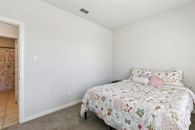 a bedroom with a bed and a cabinets