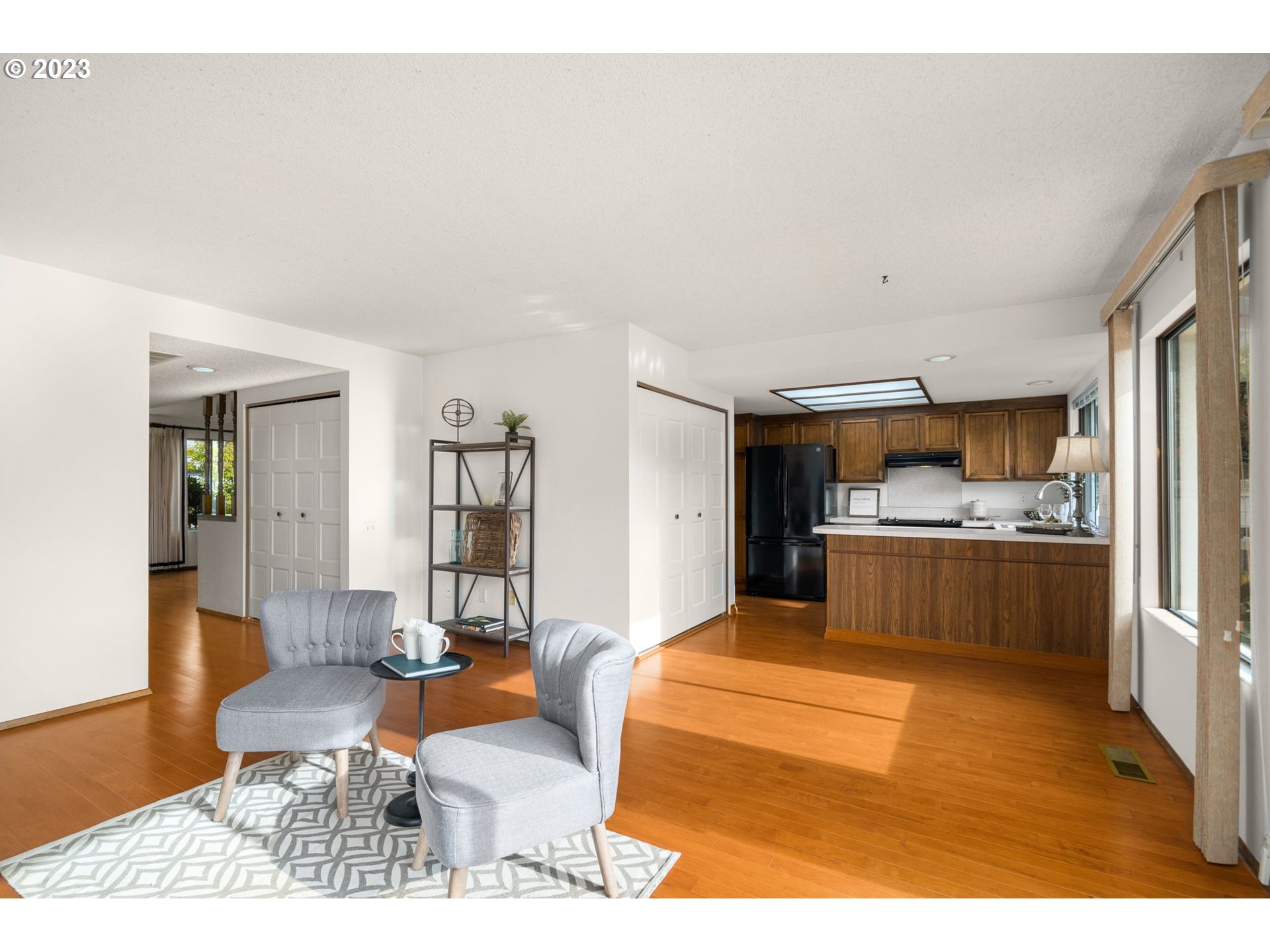 15735 Southwest Highland Court Portland, OR 97224 - Photo 12 of 39 a living room with furniture and kitchen view