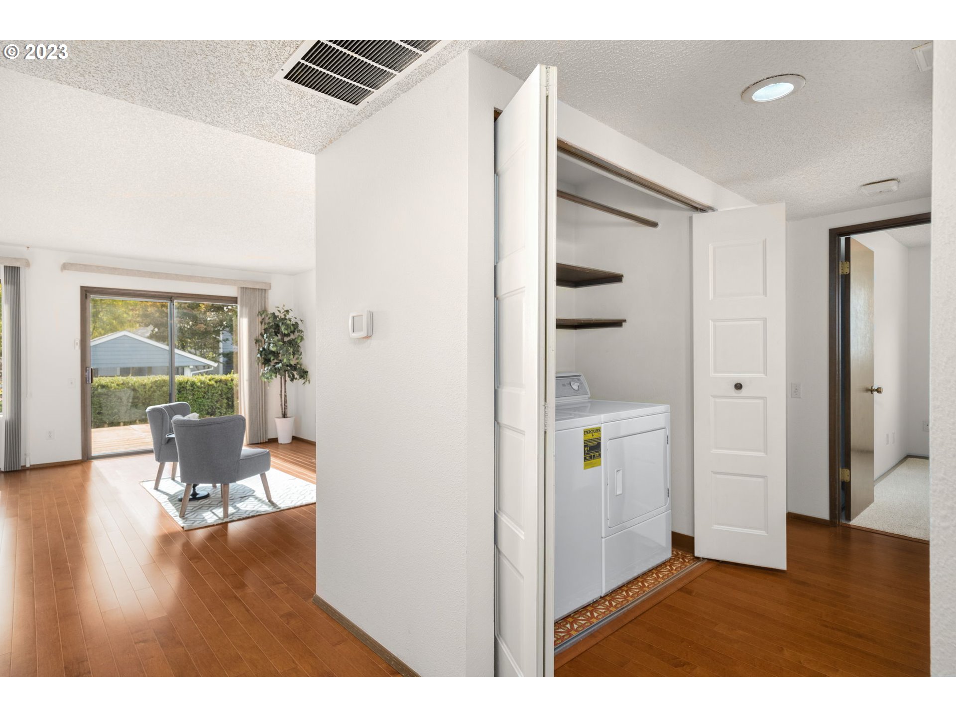15735 Southwest Highland Court Portland, OR 97224 - Photo 16 of 39 a view interior of house and hall with wooden floor