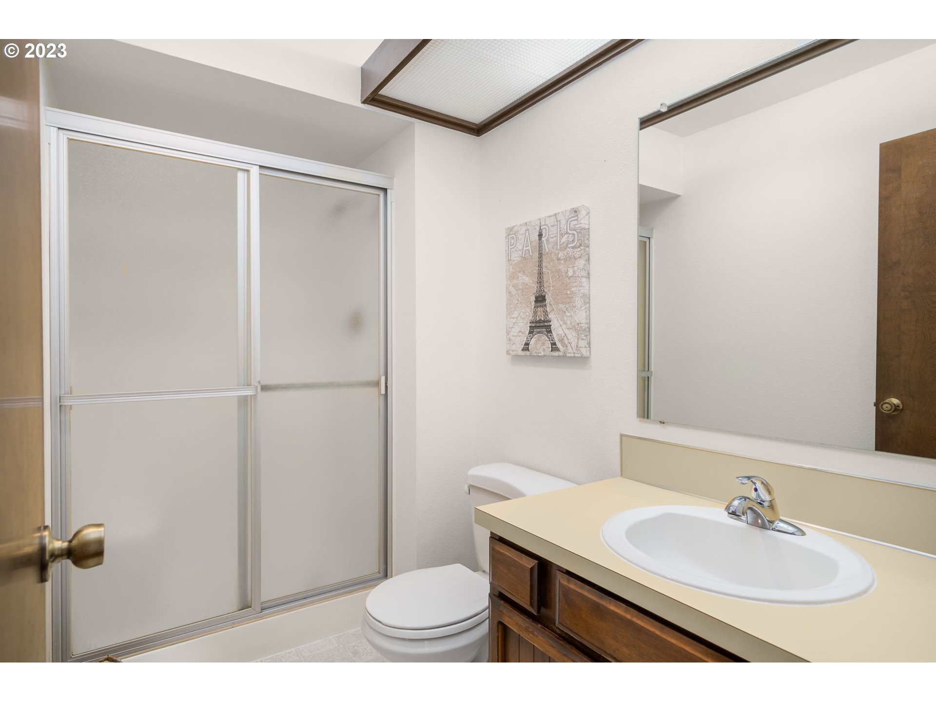 15735 Southwest Highland Court Portland, OR 97224 - Photo 18 of 39 a bathroom with a sink toilet and mirror