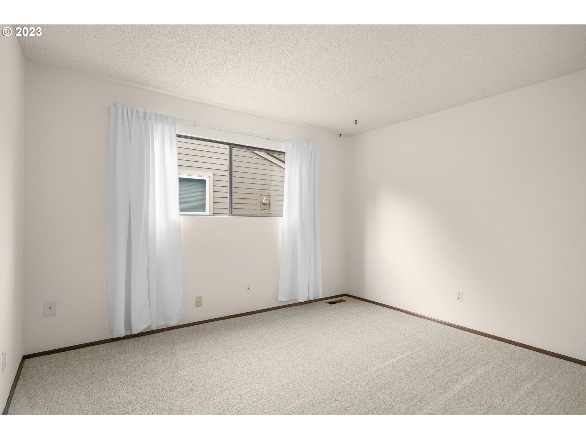 15735 Southwest Highland Court Portland, OR 97224 - Photo 19 of 39 an empty room with windows