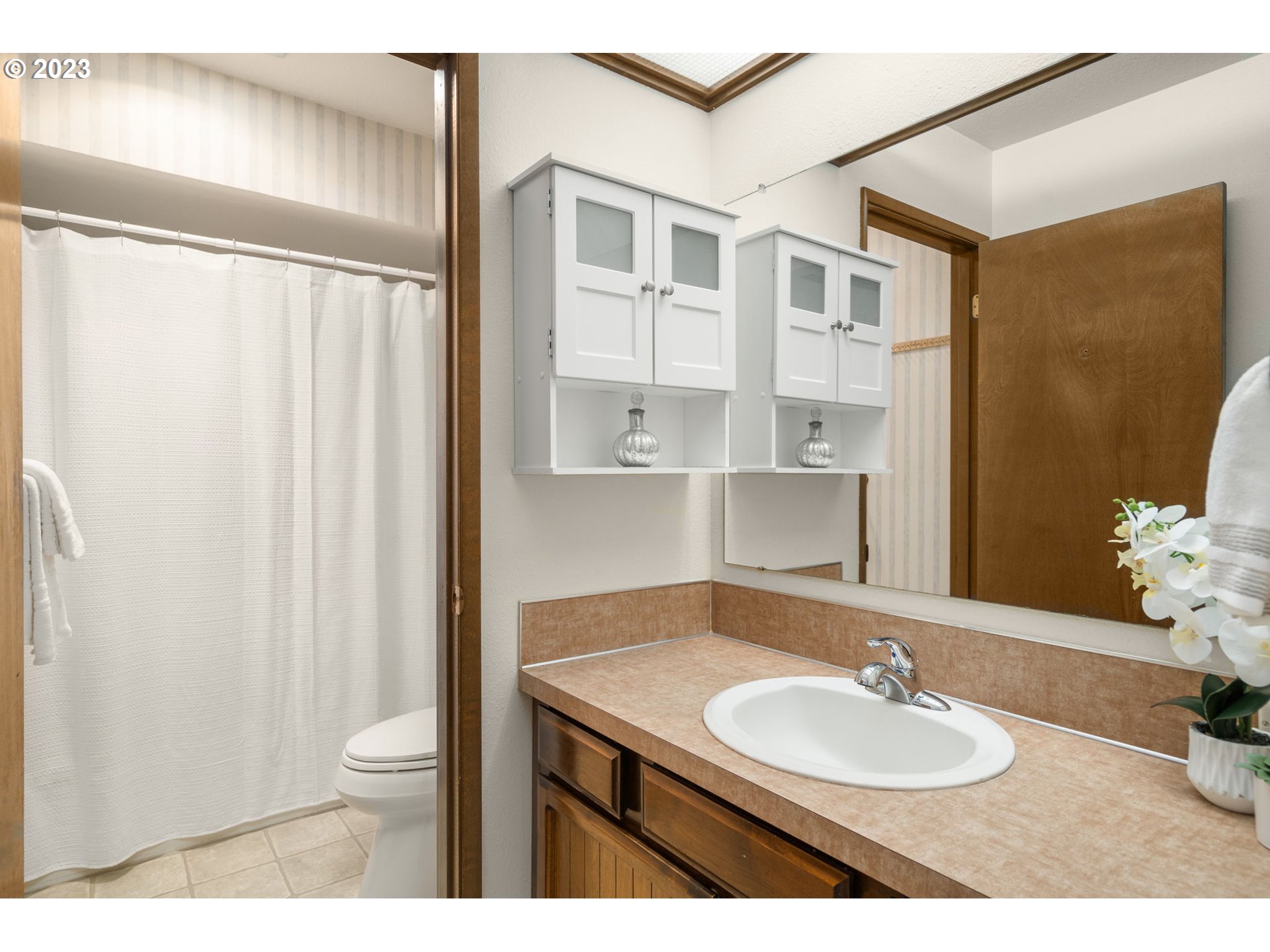 15735 Southwest Highland Court Portland, OR 97224 - Photo 23 of 39 a bathroom with a sink toilet and shower