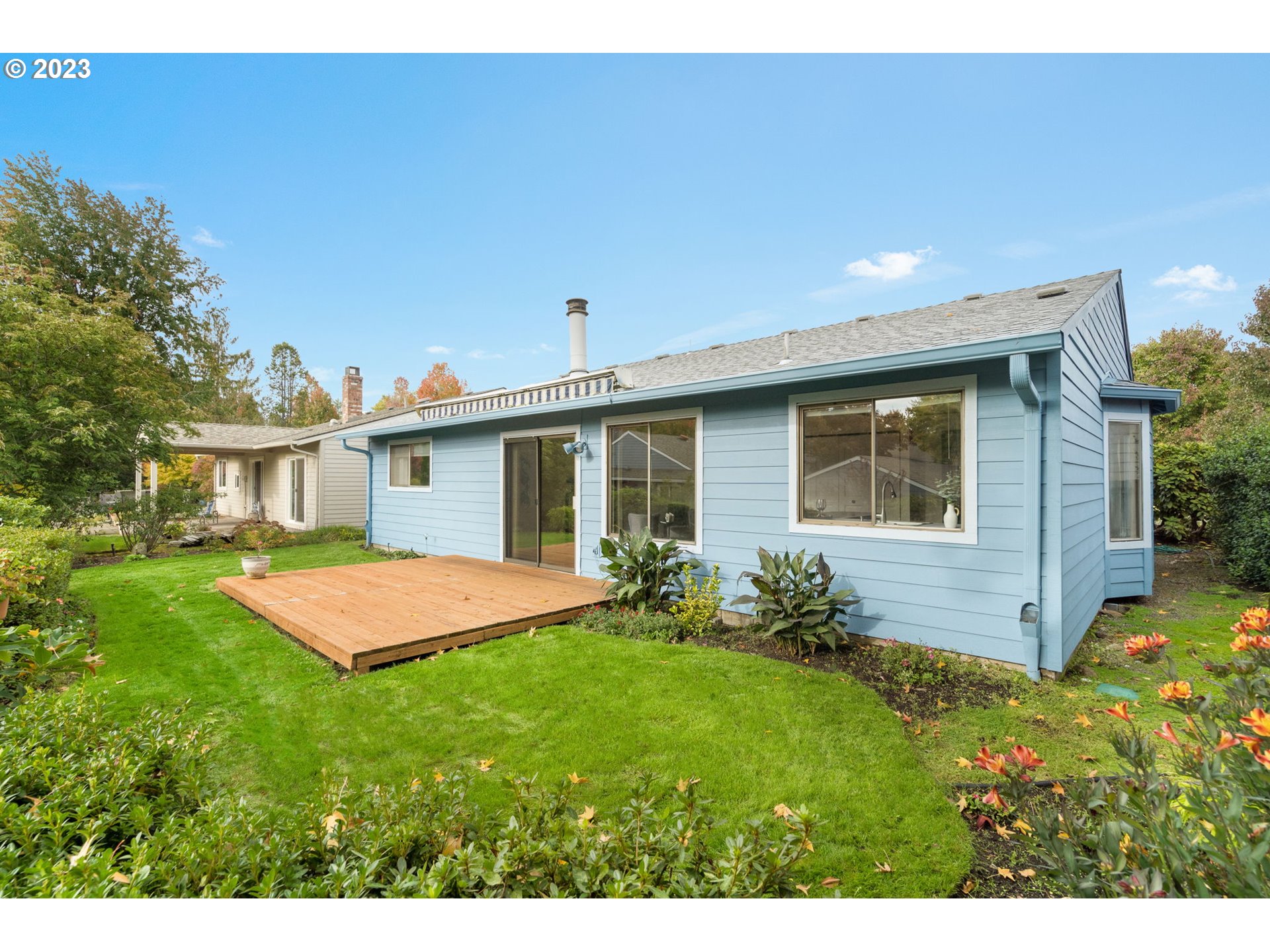 15735 Southwest Highland Court Portland, OR 97224 - Photo 24 of 39 a front view of house with yard and outdoor seating