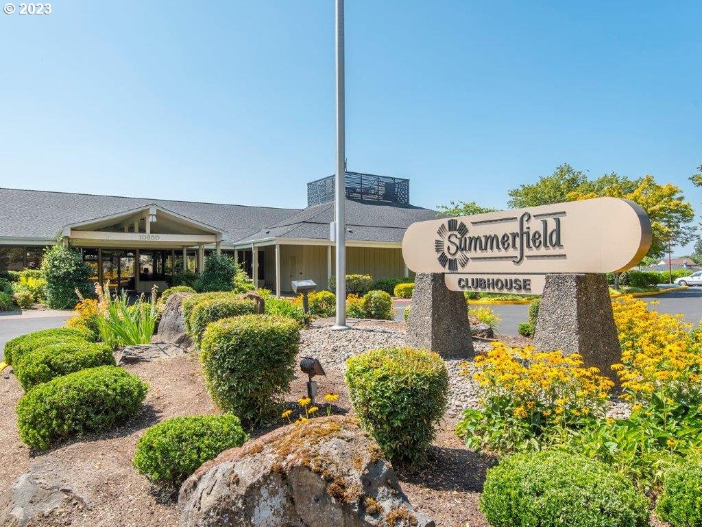 15735 Southwest Highland Court Portland, OR 97224 - Photo 27 of 39 a front view of a house with garden and sitting area