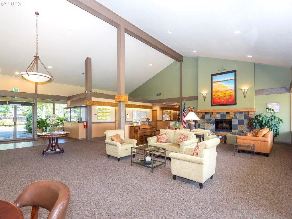 15735 Southwest Highland Court Portland, OR 97224 - Photo 30 of 39 a living room with furniture and a large window
