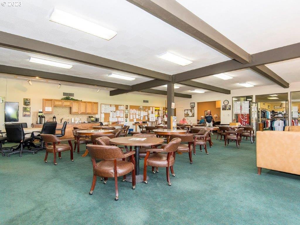 15735 Southwest Highland Court Portland, OR 97224 - Photo 33 of 39 a room with lots of tables a large window and chairs