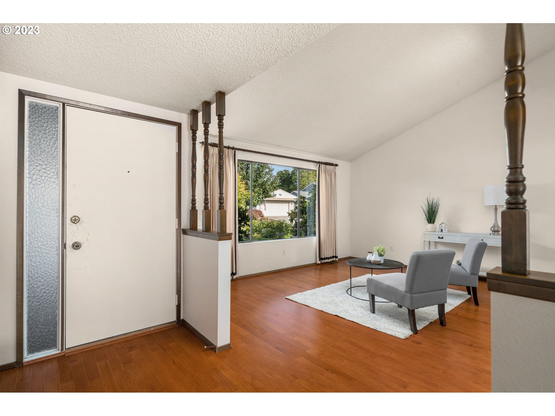 15735 Southwest Highland Court Portland, OR 97224 - Photo 5 of 39 a living room with furniture and a flat screen tv