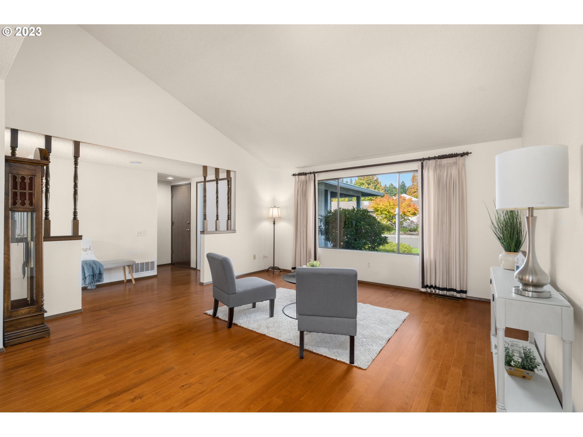 15735 Southwest Highland Court Portland, OR 97224 - Photo 6 of 39 a living room with furniture and a flat screen tv