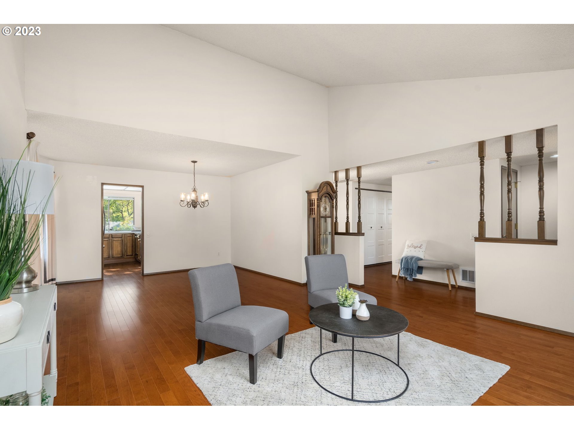 15735 Southwest Highland Court Portland, OR 97224 - Photo 7 of 39 a living room with furniture a wooden floor and next to a window