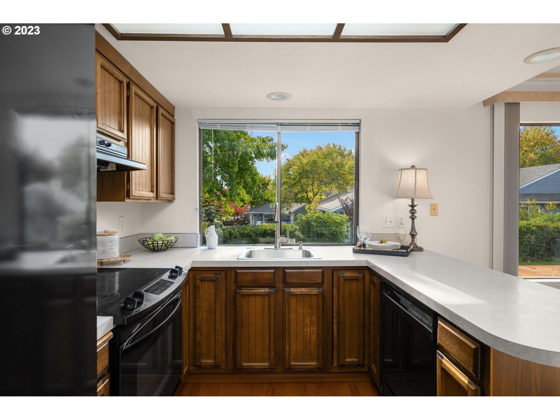 15735 Southwest Highland Court Portland, OR 97224 - Photo 9 of 39 a kitchen with a sink and large window