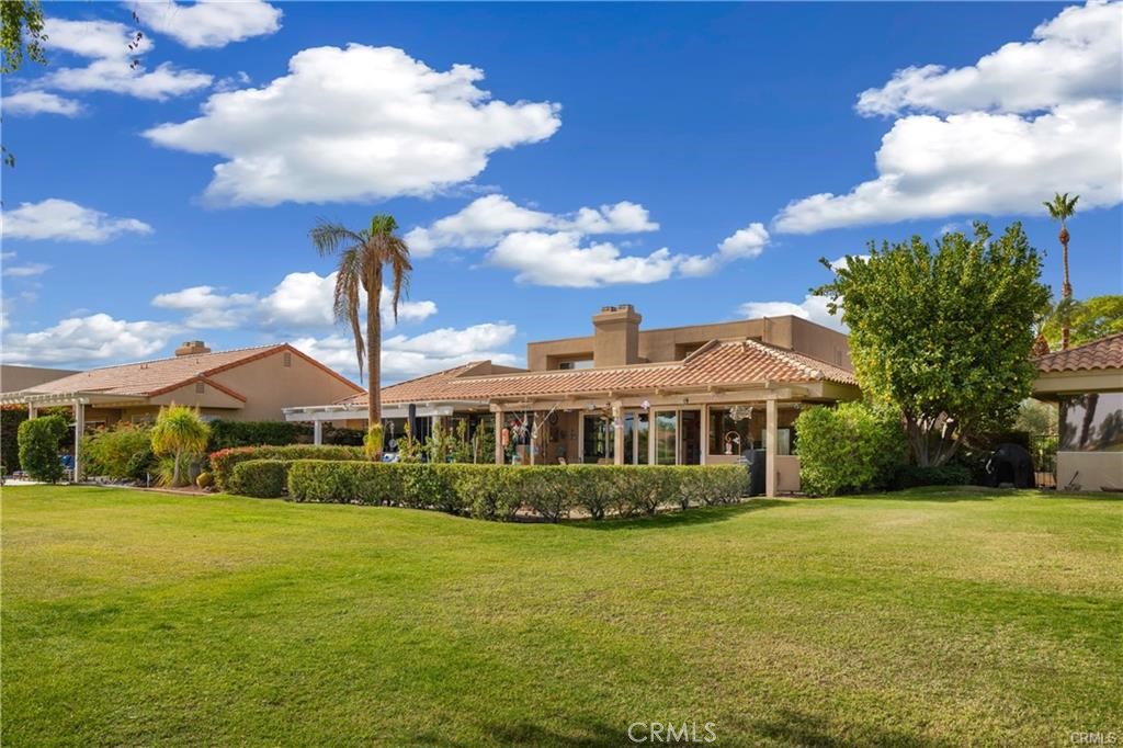 21 Colonial Drive Rancho Mirage, CA 92270 - Photo 3 of 23 low hedge has been removed