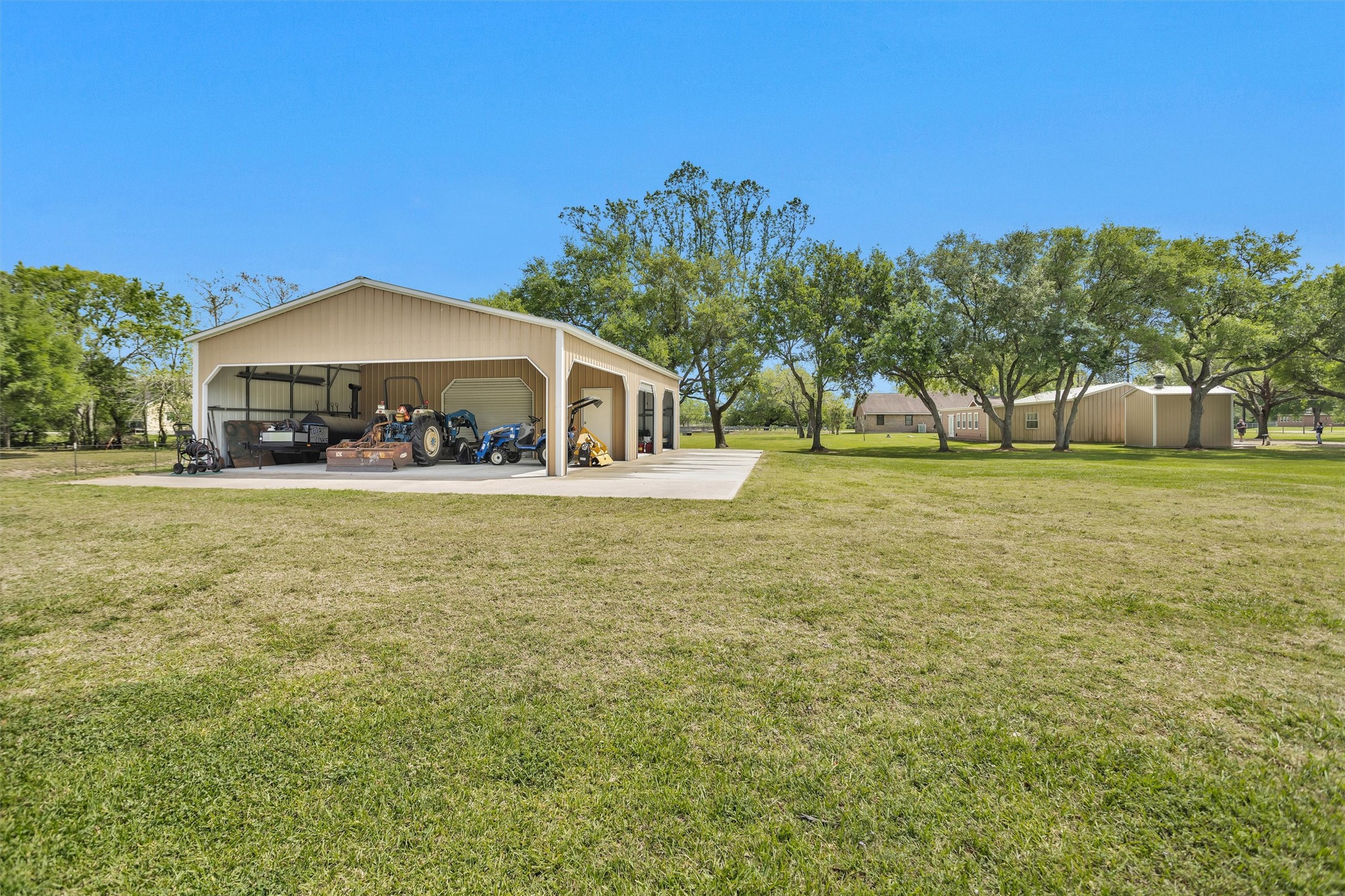 4402 Spears Road Manvel, TX 77578 - Photo 8 of 38 a front view of a building with a yard