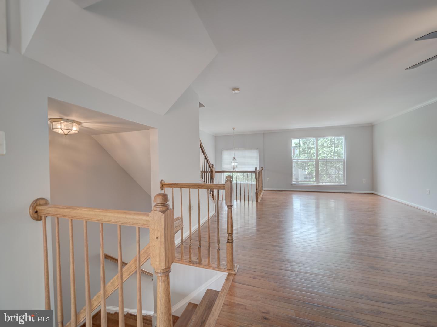 8241 Humphrey Lane Manassas, VA 20109 - Photo 12 of 55 a view of empty room with wooden floor and fan