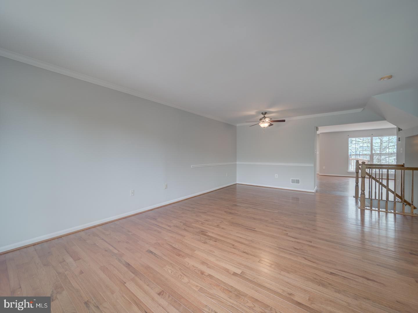 8241 Humphrey Lane Manassas, VA 20109 - Photo 15 of 55 a view of empty room with wooden floor and fan