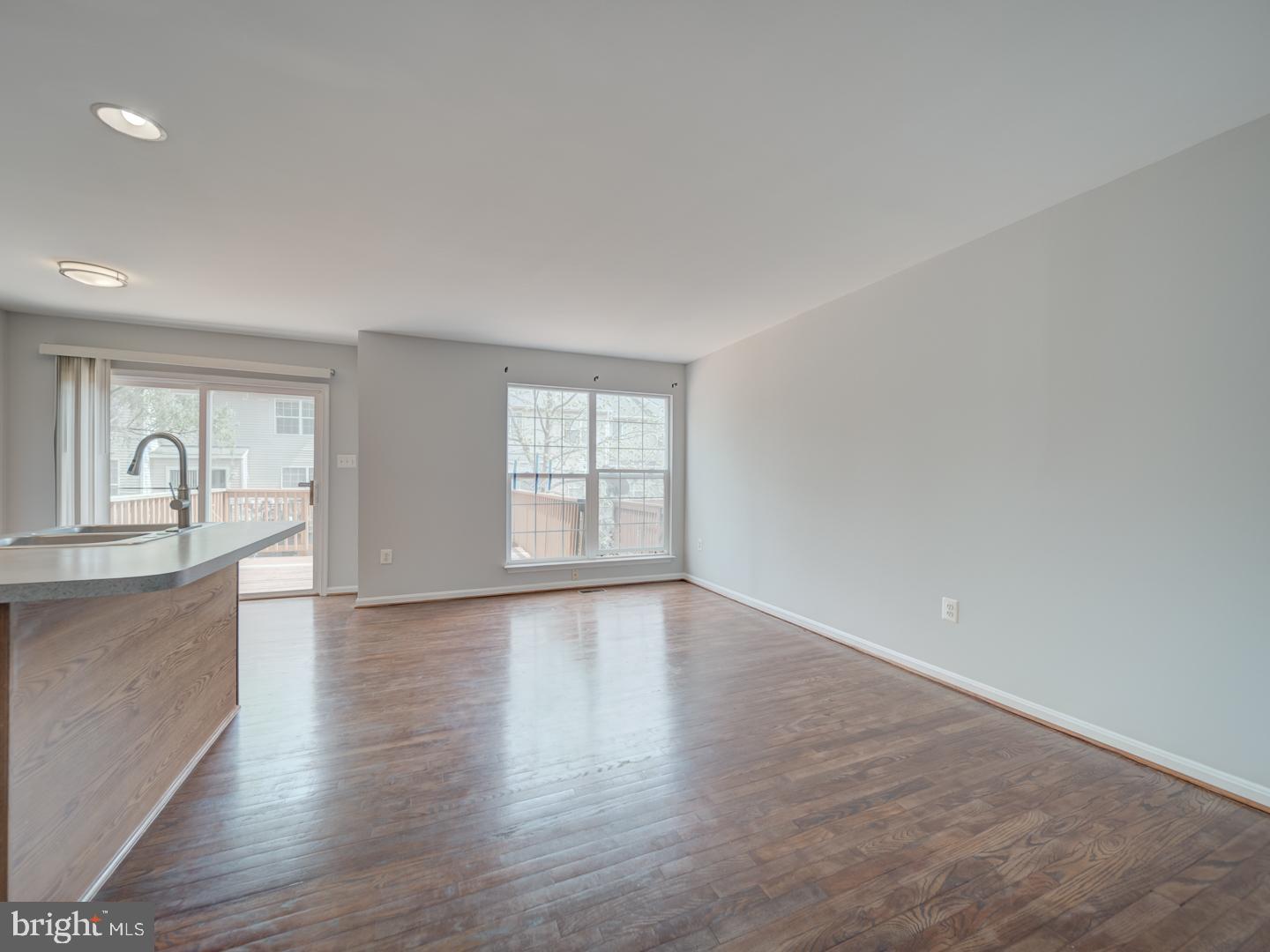 8241 Humphrey Lane Manassas, VA 20109 - Photo 16 of 55 a view of an empty room with window and wooden floor