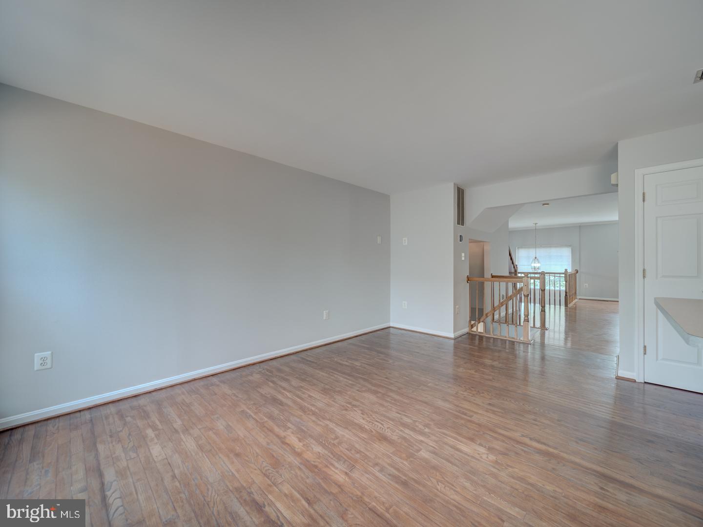 8241 Humphrey Lane Manassas, VA 20109 - Photo 18 of 55 a view of an empty room with wooden floor and a window
