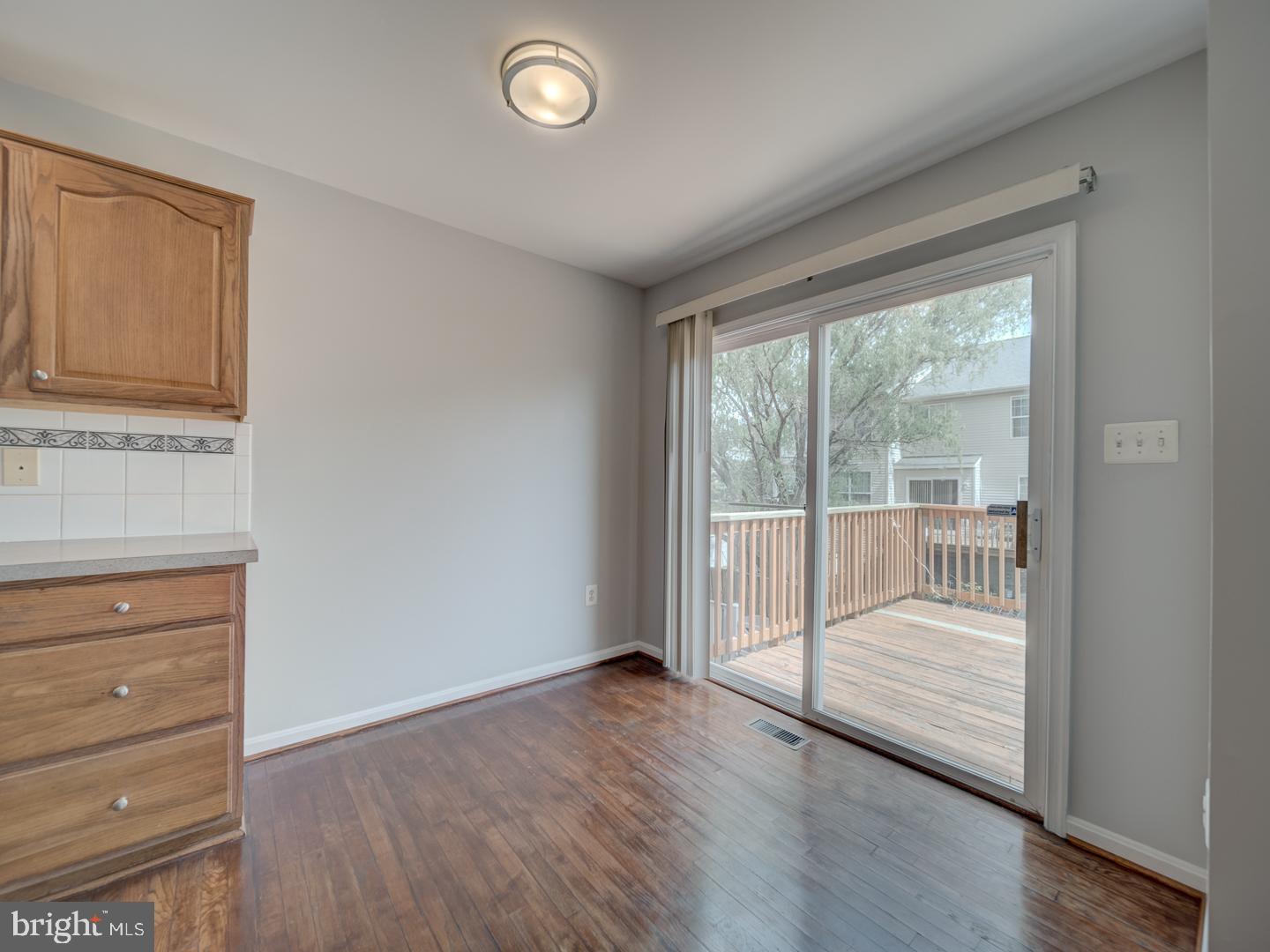 8241 Humphrey Lane Manassas, VA 20109 - Photo 20 of 55 wooden floor in an empty room with a window