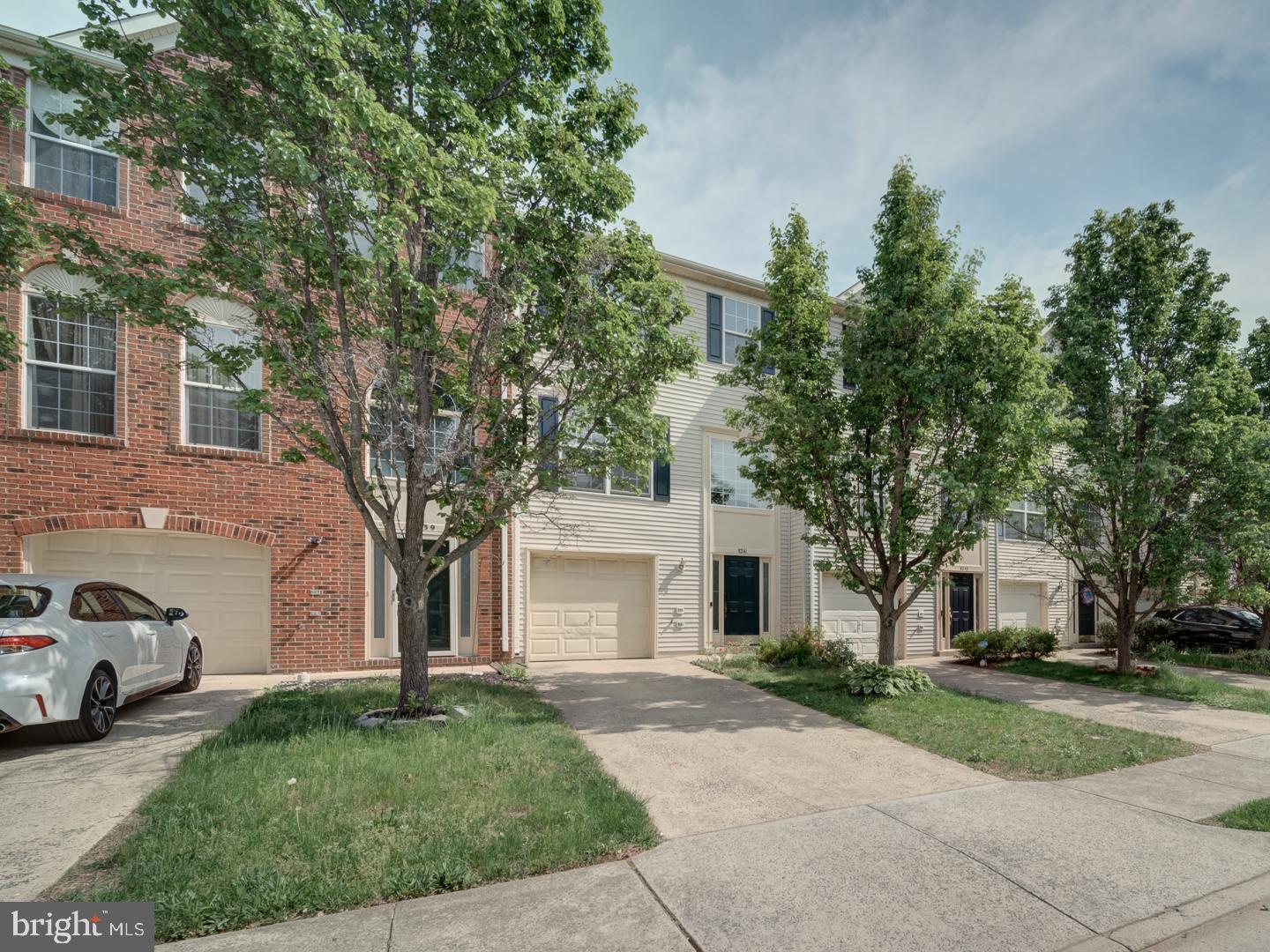 8241 Humphrey Lane Manassas, VA 20109 - Photo 2 of 55 a white house that has a tree in front of it