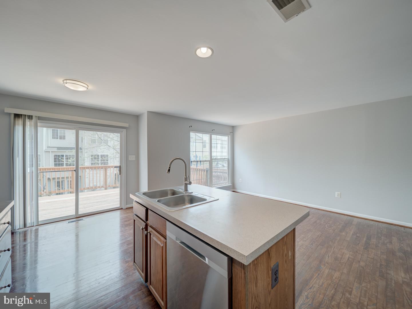 8241 Humphrey Lane Manassas, VA 20109 - Photo 27 of 55 a kitchen that has a sink and a stove