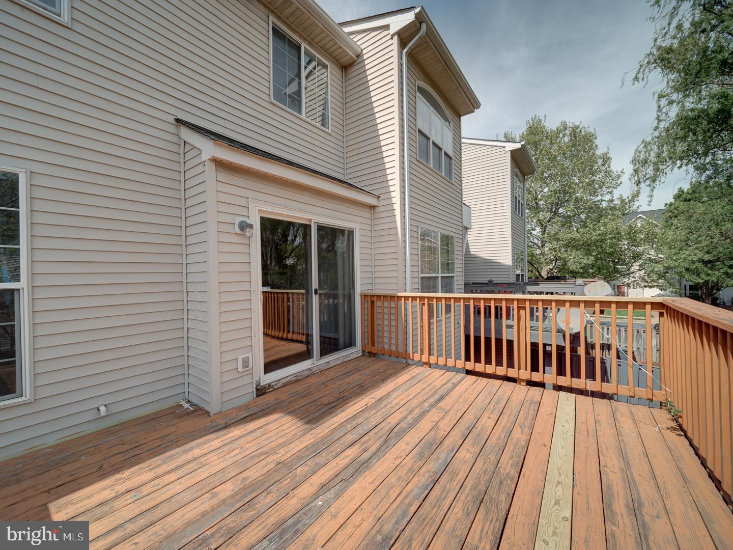 8241 Humphrey Lane Manassas, VA 20109 - Photo 29 of 55 a view of a wooden deck with a yard
