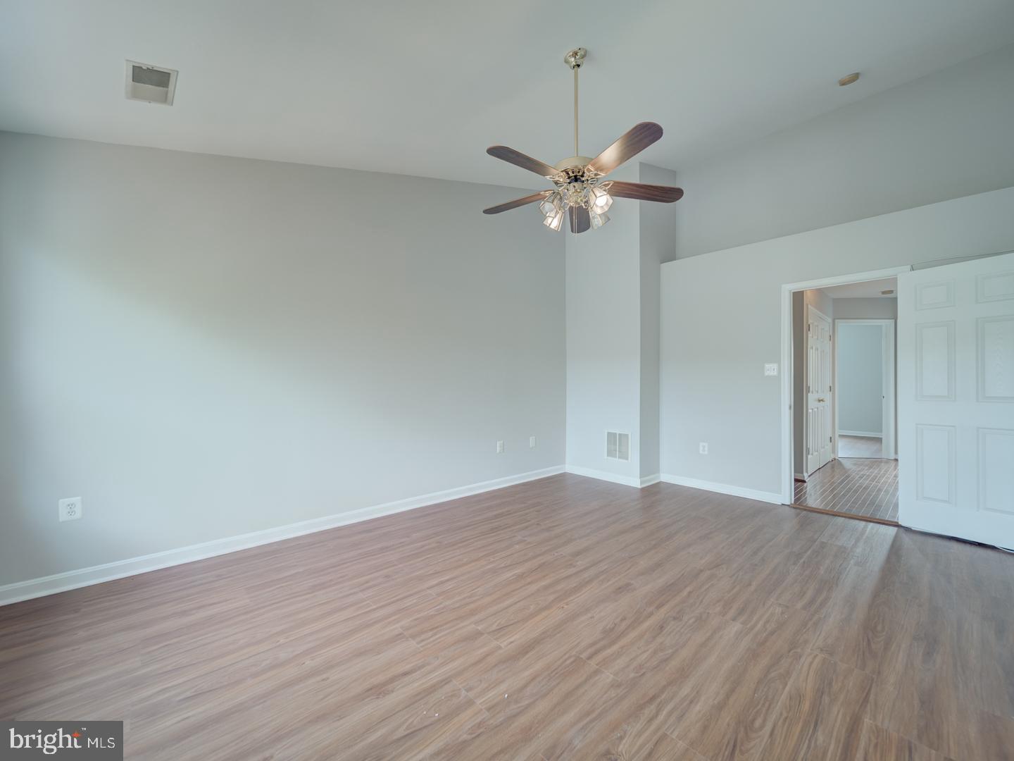 8241 Humphrey Lane Manassas, VA 20109 - Photo 35 of 55 a view of empty room with wooden floor