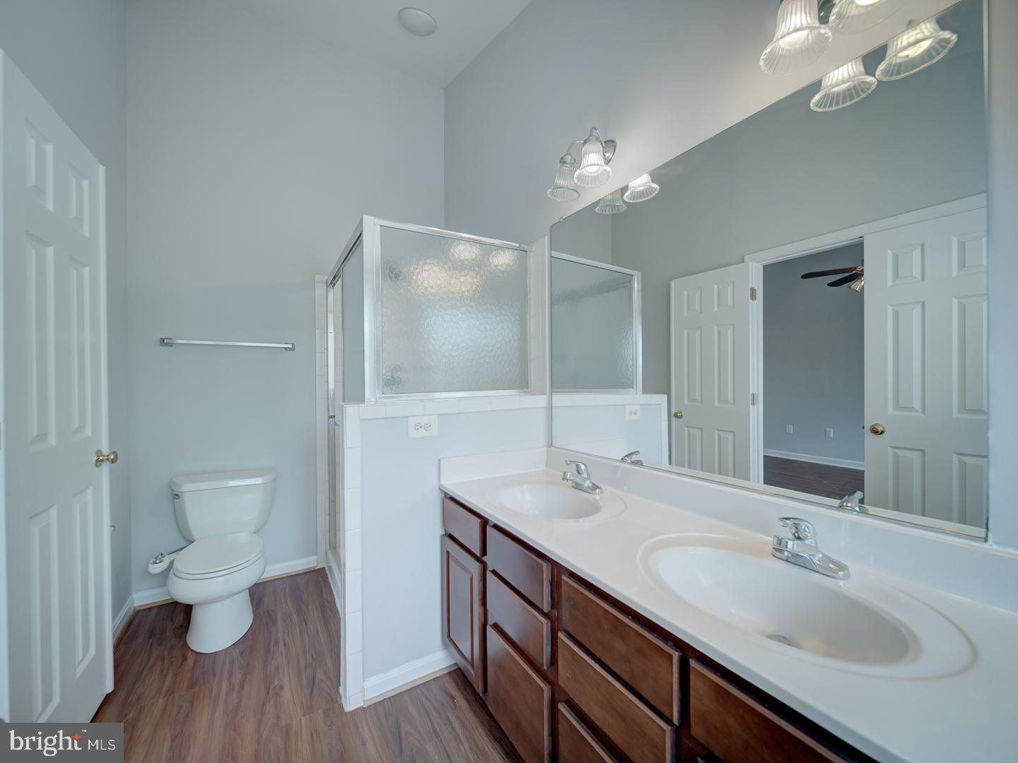8241 Humphrey Lane Manassas, VA 20109 - Photo 37 of 55 a bathroom with a sink a toilet and a large mirror
