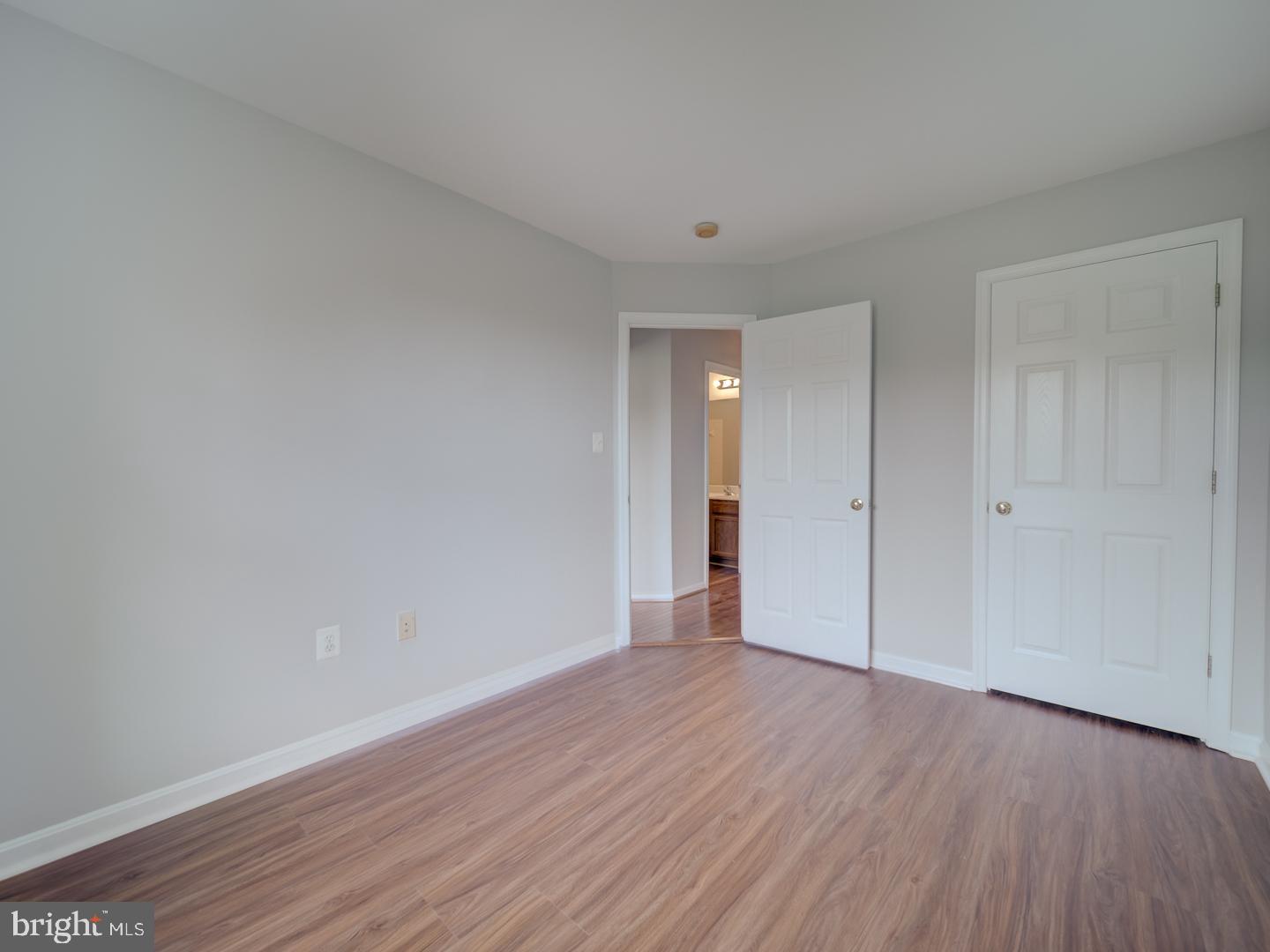8241 Humphrey Lane Manassas, VA 20109 - Photo 41 of 55 a view of an empty room with wooden floor