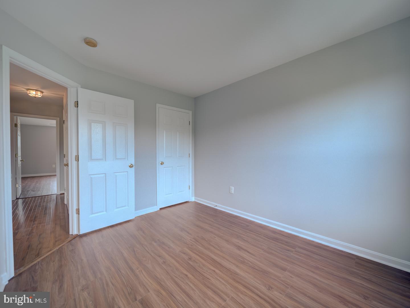 8241 Humphrey Lane Manassas, VA 20109 - Photo 42 of 55 a view of empty room with wooden floor