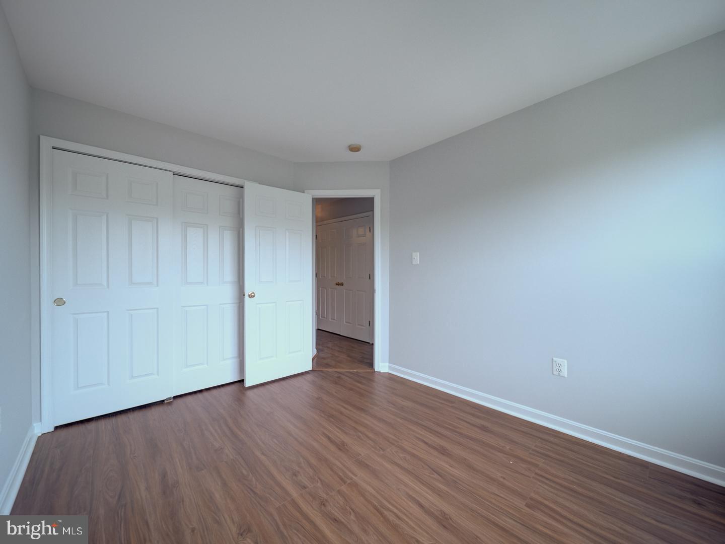 8241 Humphrey Lane Manassas, VA 20109 - Photo 45 of 55 a view of an empty room with wooden floor