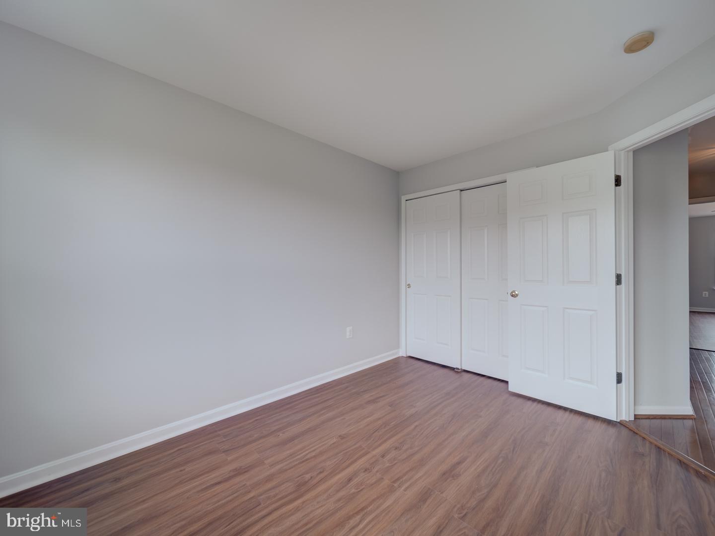 8241 Humphrey Lane Manassas, VA 20109 - Photo 46 of 55 a view of an empty room with wooden floor