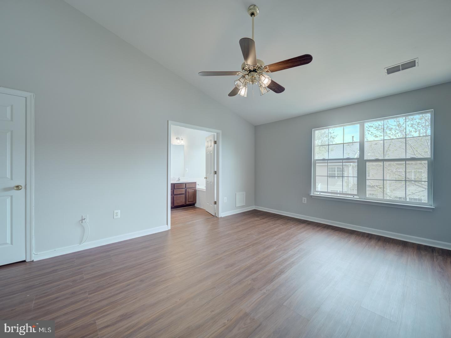 8241 Humphrey Lane Manassas, VA 20109 - Photo 52 of 55 a view of an empty room with wooden floor and a window