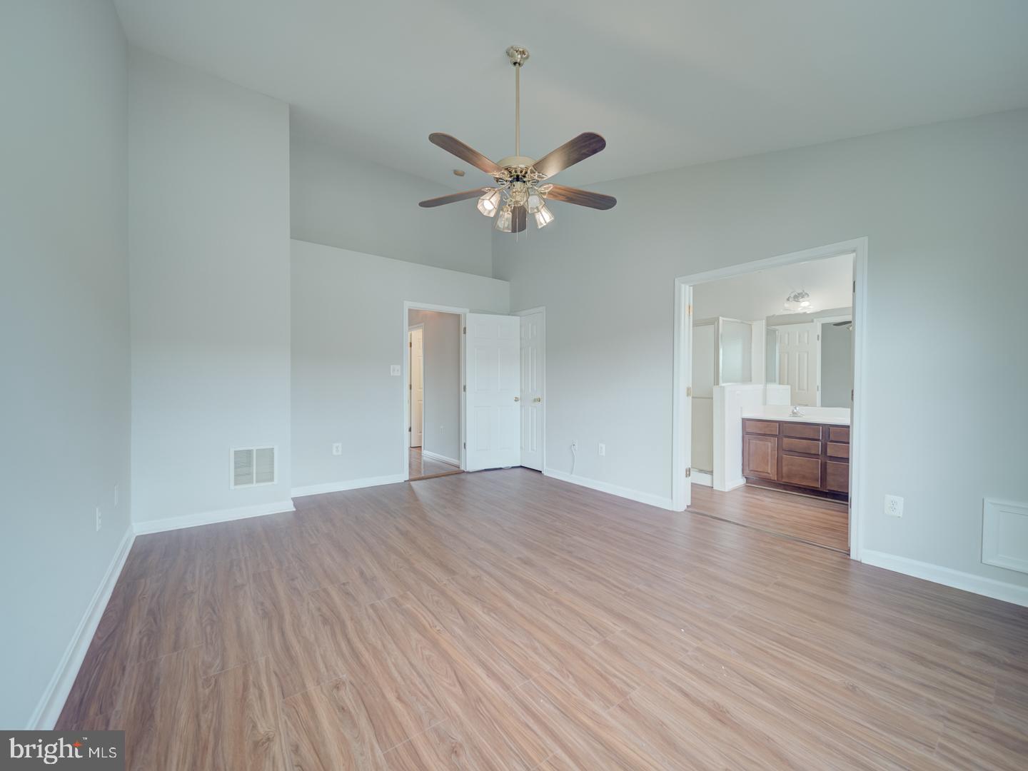8241 Humphrey Lane Manassas, VA 20109 - Photo 53 of 55 an empty room with wooden floor and a ceiling fan