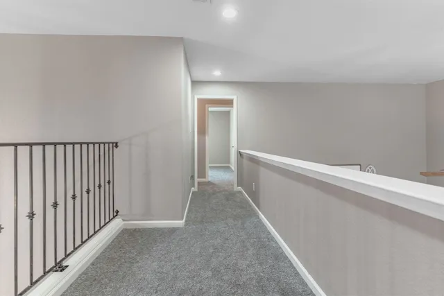 a view of a hallway with closet area