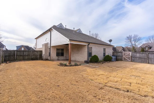 a view of a house with snow on the road