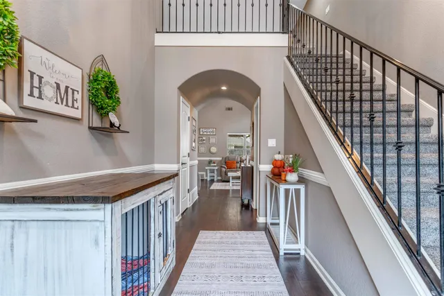 a view of living room kitchen with furniture and stairs