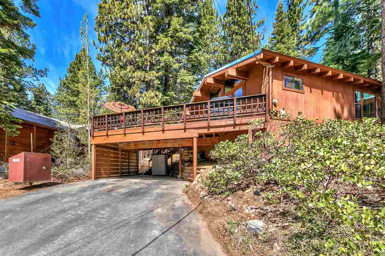 11576 Chamonix Road Truckee, CA 96161 - Photo 2 of 21 a blue and white house with a large tree and a yard in front of it