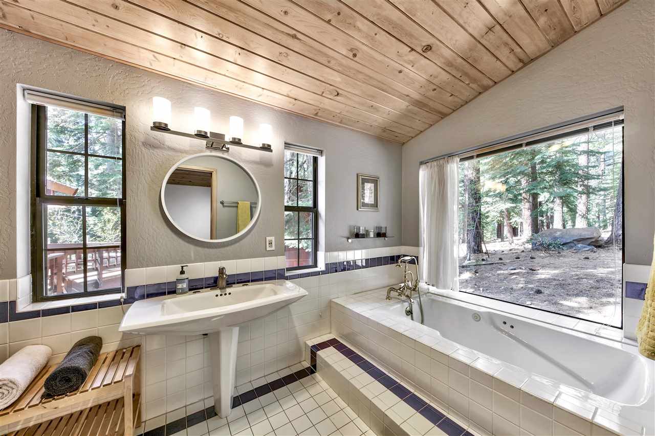 11576 Chamonix Road Truckee, CA 96161 - Photo 12 of 21 a bathroom with a double vanity sink a mirror and a large window
