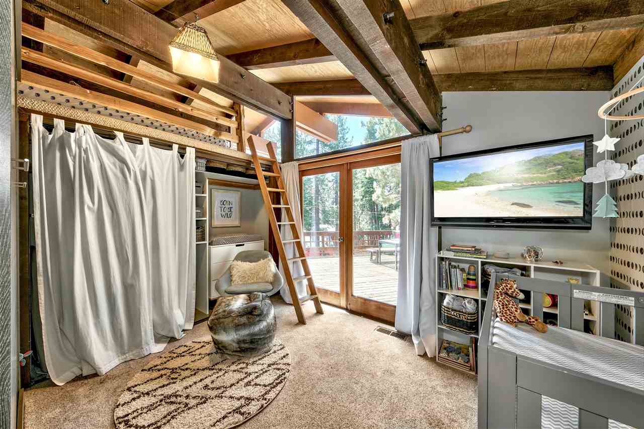 11576 Chamonix Road Truckee, CA 96161 - Photo 13 of 21 a room with lots of furniture and a flat screen tv