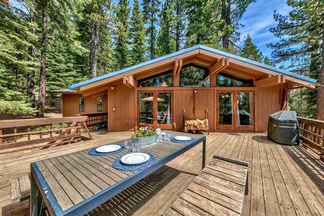 11576 Chamonix Road Truckee, CA 96161 - Photo 18 of 21 a view of a roof deck with wooden floor table and chairs