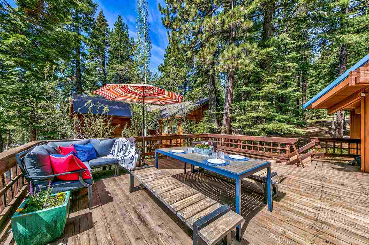 11576 Chamonix Road Truckee, CA 96161 - Photo 3 of 21 an outdoor space with patio lots of furniture and umbrella